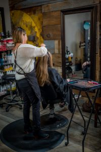 Tina Chung Coloring a Client's Hair