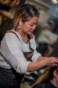 Tina Chung Coloring a Client's Hair