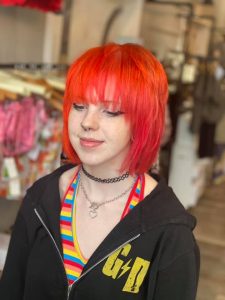 Short, Layered Haircut and Orange and Red Fashion Co