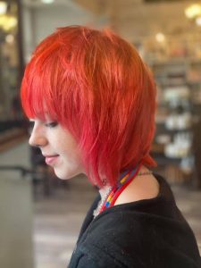 Short, Layered Haircut and Orange and Red Fashion Co