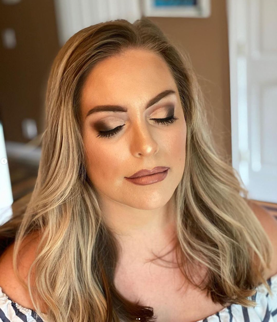 A blonde woman with formal makeup